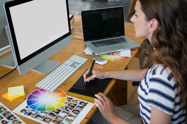 female-graphic-designer-using-graphics-tablet-at-d-2023-11-27-05-36-03-utc