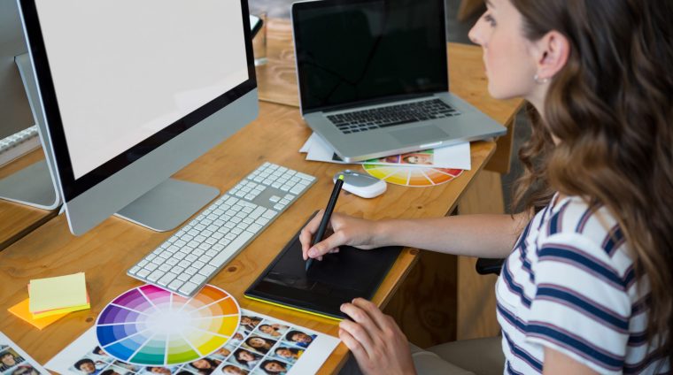 female-graphic-designer-using-graphics-tablet-at-d-2023-11-27-05-36-03-utc