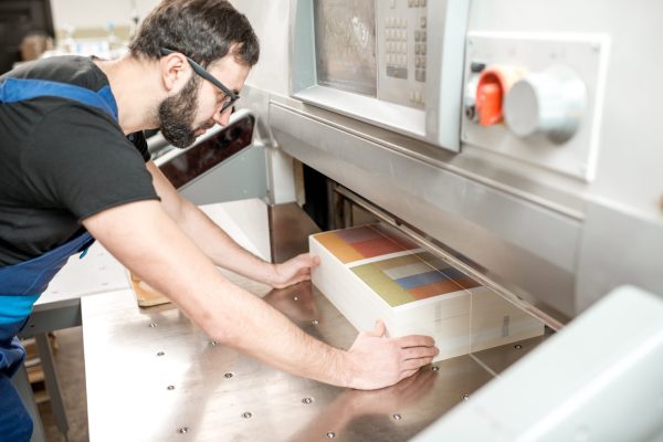 man-working-with-cutting-machine-at-the-printing-p-2025-03-13-03-25-04-utc