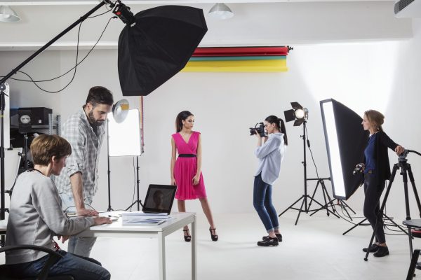 photographer-photographing-fashion-model-in-white-2024-06-24-20-22-43-utc