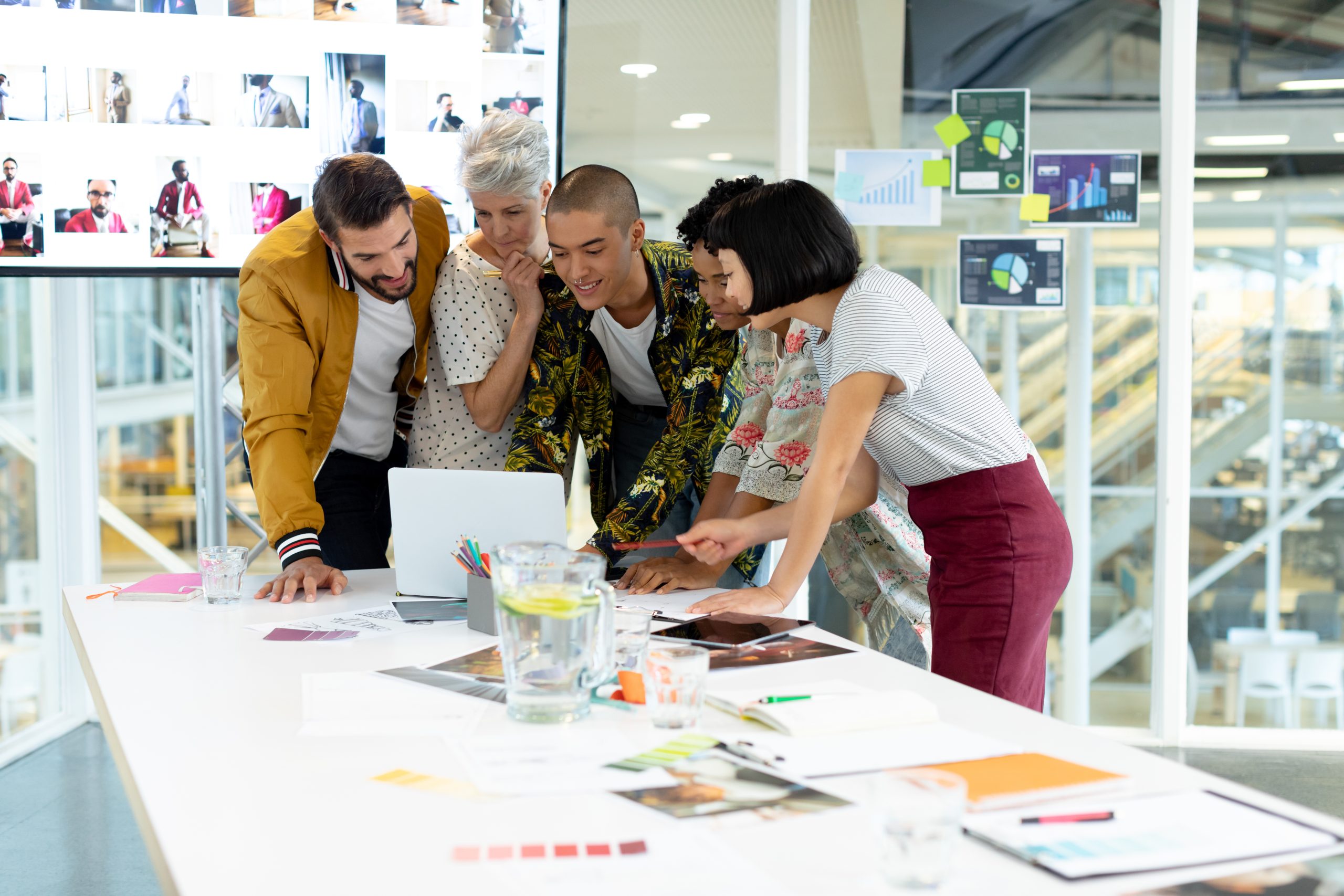 side-view-of-diverse-business-people-discussing-ov-2023-11-27-05-29-26-utc
