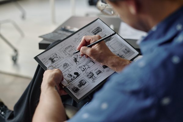 sketches-on-paper-in-male-hands-2025-02-11-09-45-48-utc