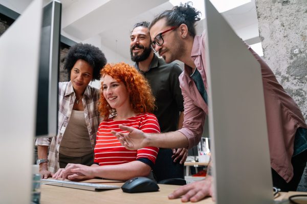 smiling-diverse-colleagues-gather-in-boardroom-bra-2023-11-27-05-24-15-utc