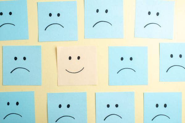 top-view-of-sad-and-smiling-emoji-faces-on-small-n-2025-02-10-05-27-58-utc