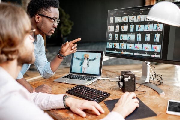 two-photographers-working-on-the-computers-in-the-2025-03-13-03-08-29-utc